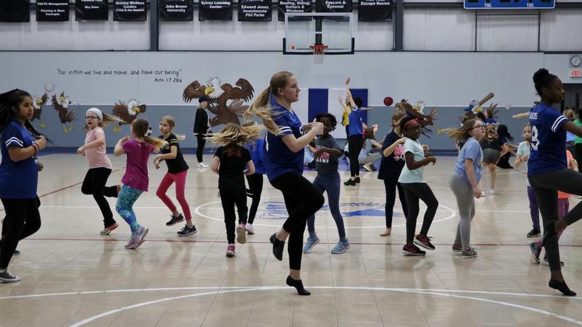 Three members of the Summit Christian Academy dance team, Nataly Romero, from left, Rachel Beumer and Aujanai Hawkins led a group of elementary students from their school in a rehearsal for the school’s annual Elementary Dance Camp Fundraiser. The international six-member team includes members who call five different countries home.