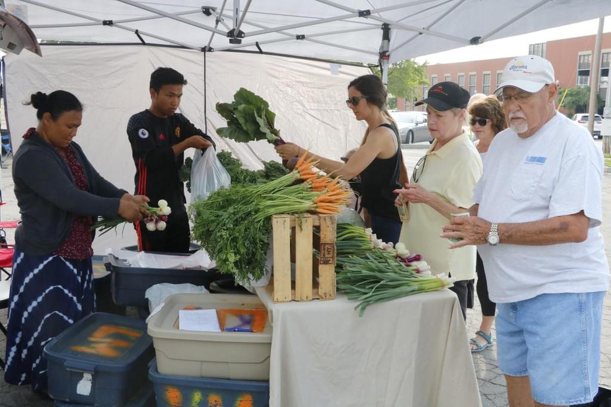 Customers stood in line at a recent Lee’s Summit Farmers Market to buy produce at the Lee’s Summit Farmers Market in 2018. The market has been a mainstay for the city for 28 years.