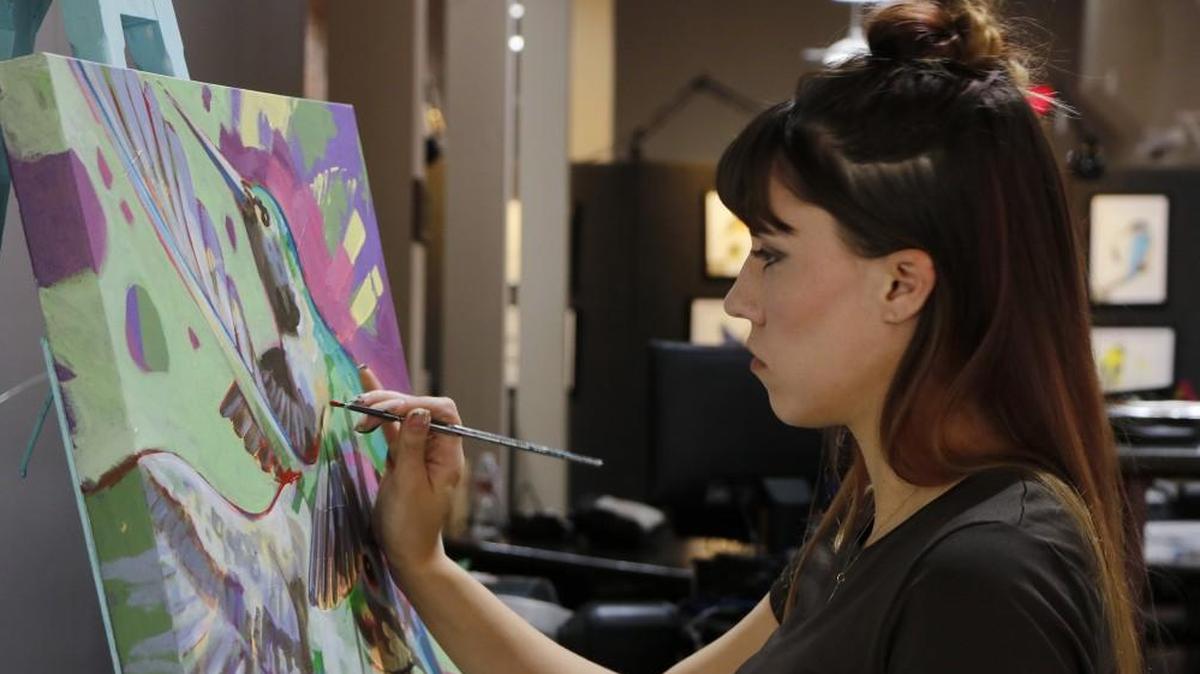 Lee’s Summit artist Ivey Zoellers adds the final touches to one of her bird paintings, “Summer Social.” Zoellers is currently exhibiting a show of her bird-themed paintings at Lee’s Summit City Hall. The exhibit, “Flock Together,” will run through Oct.12.