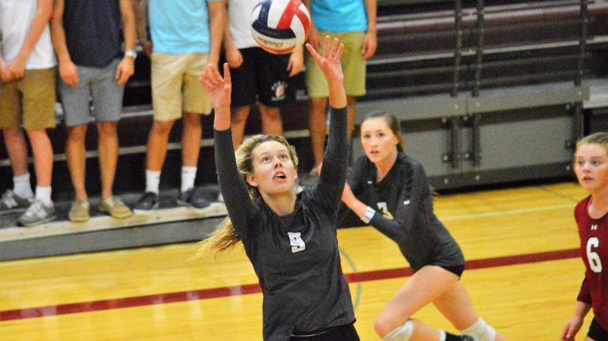 Mallory Meers of Lee’s Summit North sets the ball for a hit against Lee’s Summit West Tuesday. Meers had three kills for the Broncos, who lost 25-13, 25-22