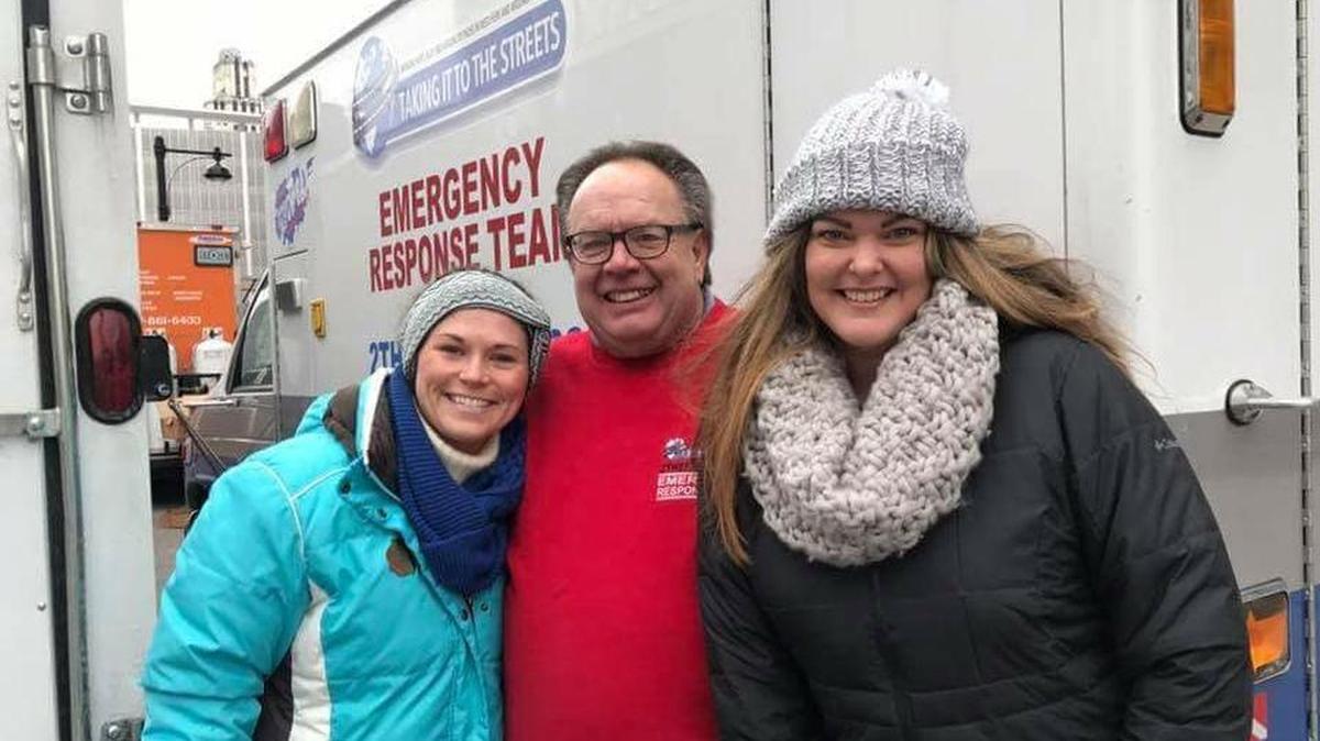 Scott Lamaster, founder and CEO of Taking it to the Streets, was outside the Kansas City Police Department Headquarters on Dec. 25, 2017, with volunteers serving hot meals to on-duty first responders only three weeks after he was badly burned in an accident with a propane gas grill.