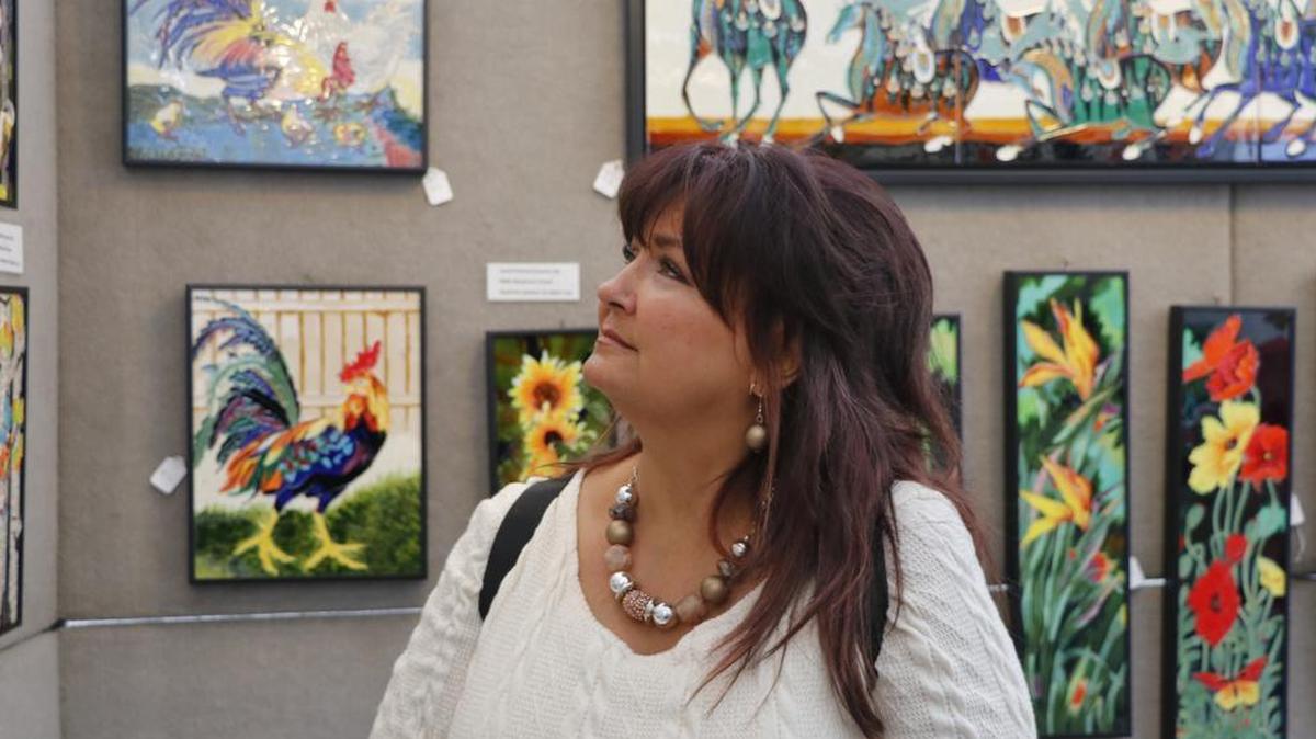 While visiting the Summit Art Festival Saturday, Patricia Forester of Harrisonville was mesmerized by the ceramic work of artists Michelle Chang and Wayne Gao. In their first year participating in the festival, the California-based artists were selected for the Best of Show award from among the field of 100 who participated in this year’s event.