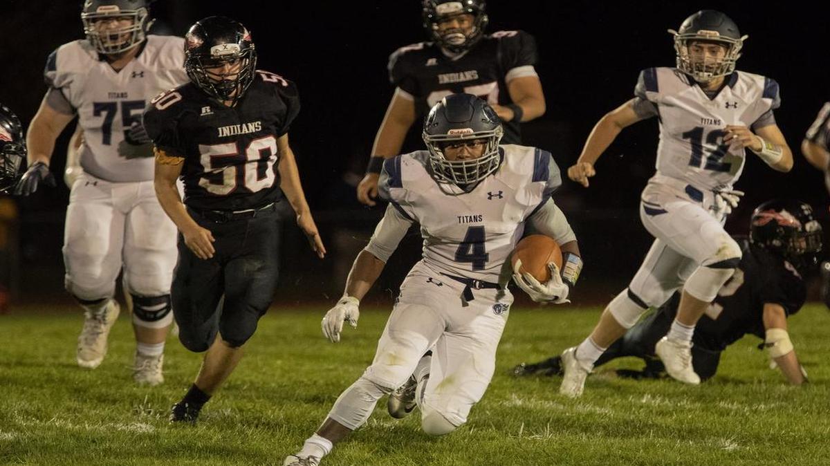 Lee’s Summit West running back Phillip Brooks (center) rushed for 143 yards and three touchdowns and also threw a touchdown pass Sept. 30, 2017, during a victory at Fort Osage.
