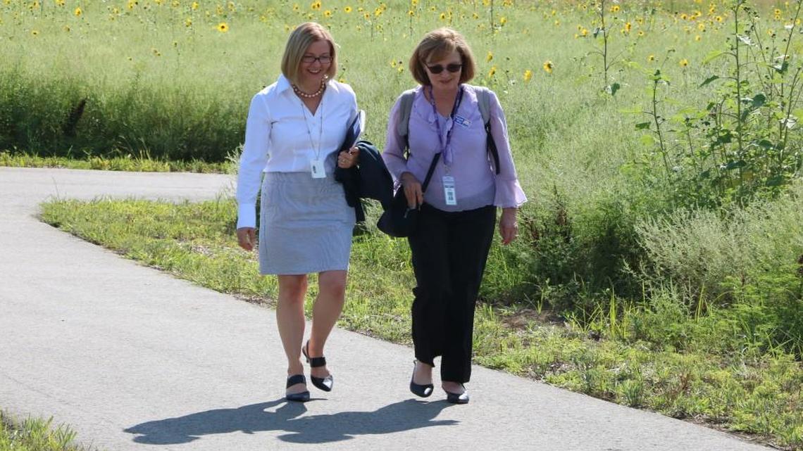 GEHA Vice President and Chief Marketing Officer, Karen Schuler (left) and Kathy Ross, vice president of clinical operations hold a walking meeting on Monday along new walking trails just opened this year on the GEHA campus in Lee’s Summit. The trails are part of a greater, long-term vision for health and wellness that extends to both GEHA employees and to the nearly two million members served by the organization.