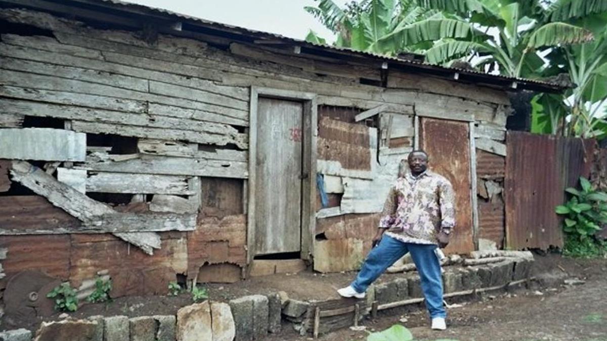 The author in front of his uncle’s house in Kouansi.