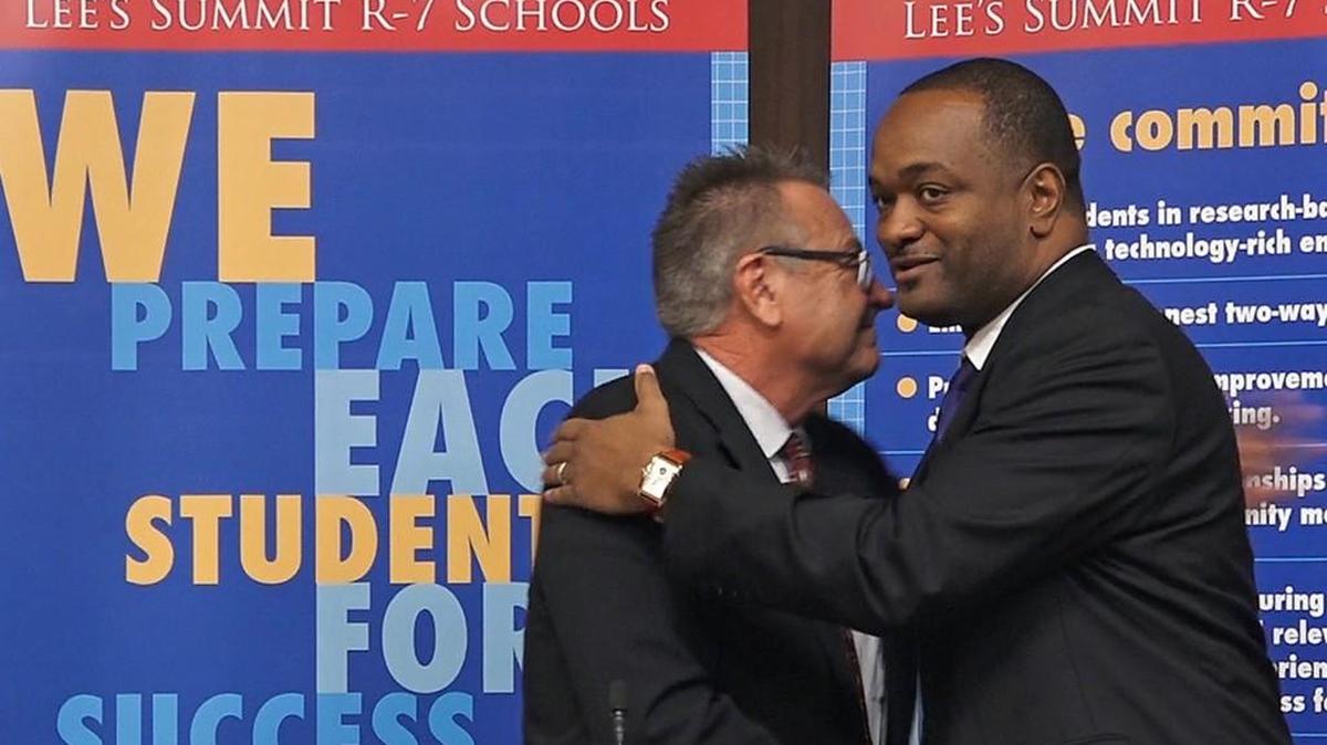 Lee’s Summit School Board president Bob White (left) greeted Lee’s Summit R-7 School District Superintendent Dennis Carpenter when he was introduced last year. Here’s hoping he can continue to keep things calm within the district.