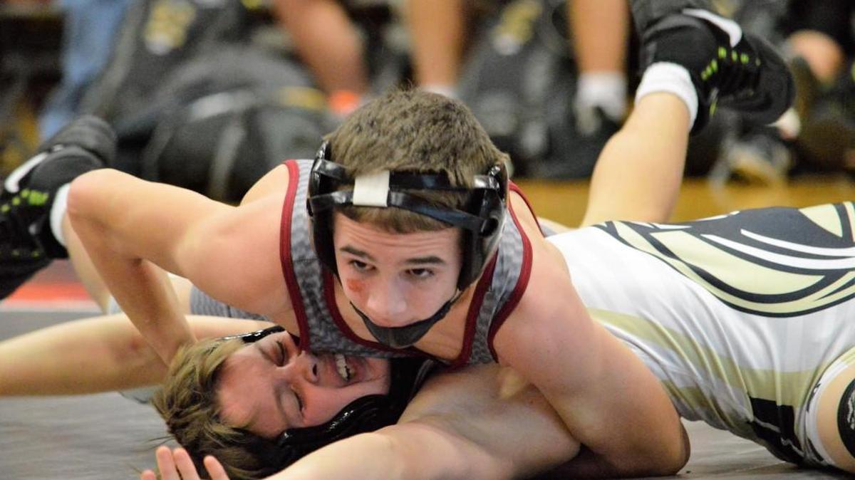 Lee’s Summit North freshman Cody Steinbrugge (top) put Raymore-Peculiar’s Logan Gaynor on his back during the 106-pound match Tuesday during at North. Steinbrugge pinned Gaynor, but the Broncos lost 42-27.