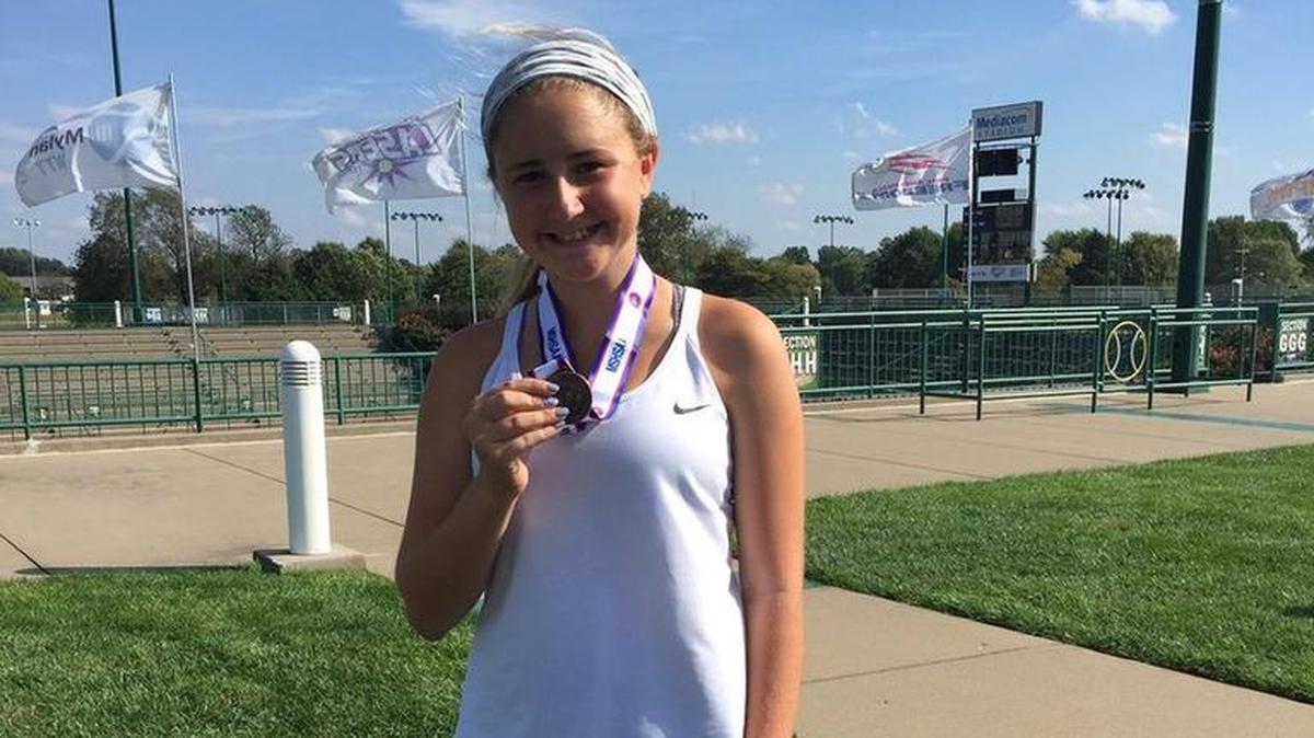 Tristen Caskey of Lee’s Summit West showed off her medal after finishing sixth in singles play during the Class 2 girls’ state tennis tournament last weekend in Springfield. Caskey, a freshman, is the first Titans’ singles player to finish all-state.