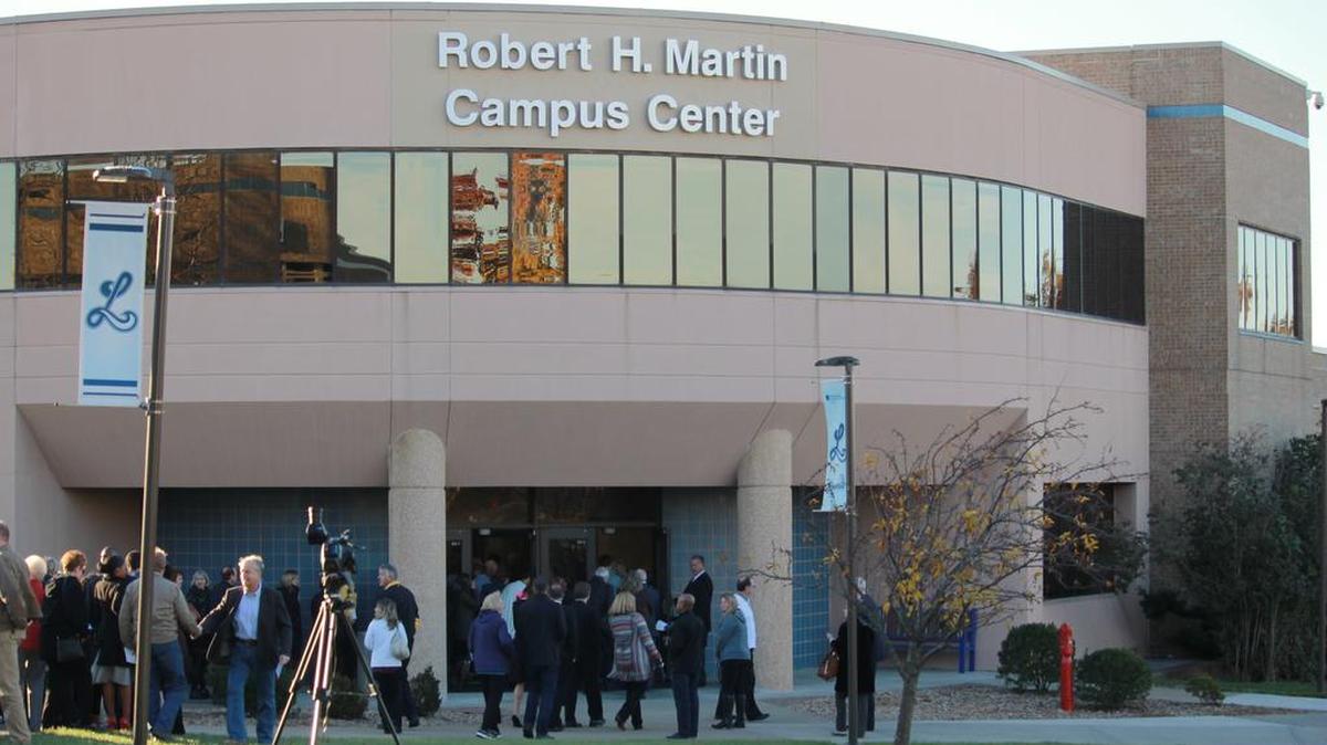 A building on the Longview campus of Metropolitan Community College was named after Robert Martin on Nov. 16. Martin, a lawyer and former state representative from Lee’s Summit, was an MCC trustee for 41 years. More than a 100 people attended the naming ceremony followed by the unveiling of the new lettering on the building.