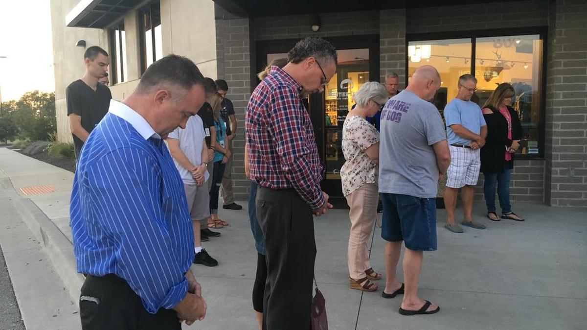 About a dozen people gathered in front Frontier Justice in Lee’s Summit on Wednesday, Aug. 23, 2017 for a vigil honoring fallen police officers. The vigil, which had been planned weeks in advance, was held three days after an off-duty Lee’s Summit police officer, Thomas Orr III, was fatally shot in Westport. Orr was an innocent bystander.