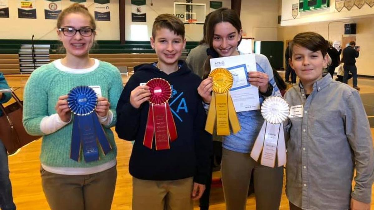 Advancing to next month’s regional spelling competition are Summit Christian Academy students (from left) Olivia Truesdale, Michael Ward, Lucie Epema, and Adrian Haack.