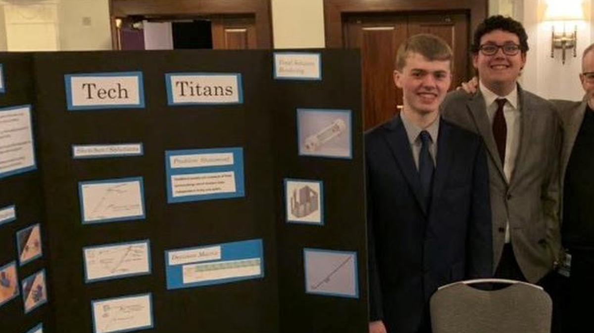 Summit Technology Academy teacher Paul Rutherford (second from right), with students who designed a high-tech cane for the blind. They are (from left) Carson Palmer, Elijah Cook and Brett Coleman.