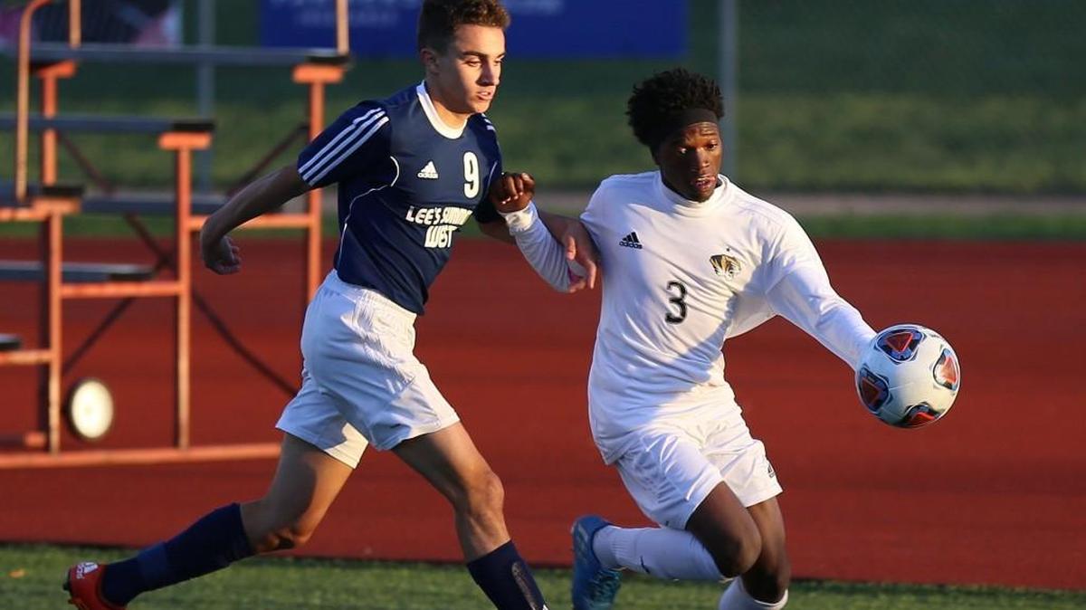 Lee’s Summit forward Keenan Johnson (right), shown here battling for possession against Lee’s Summit West earlier in the season, scored the lone goal for the Tigers during a 2-1 loss Tuesday, Oct. 31, 2017, at Sedalia Smith-Cotton in a Class 4 sectional game.