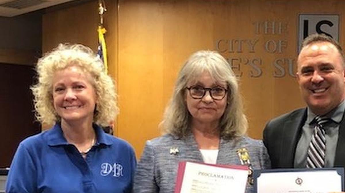 Daughters of the American Revolution Prairie Chapter Regent, Lucille Lamb and other Prairie Chapter members accept a proclamation from Mayor Bill Baird for flag week 2019.
