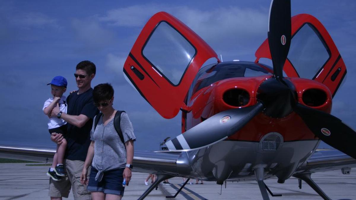 David Patrick, Christine Lauderdale and their child took a look at a new plane at the sixth annual Lee's Summit Municipal Airport Open House.