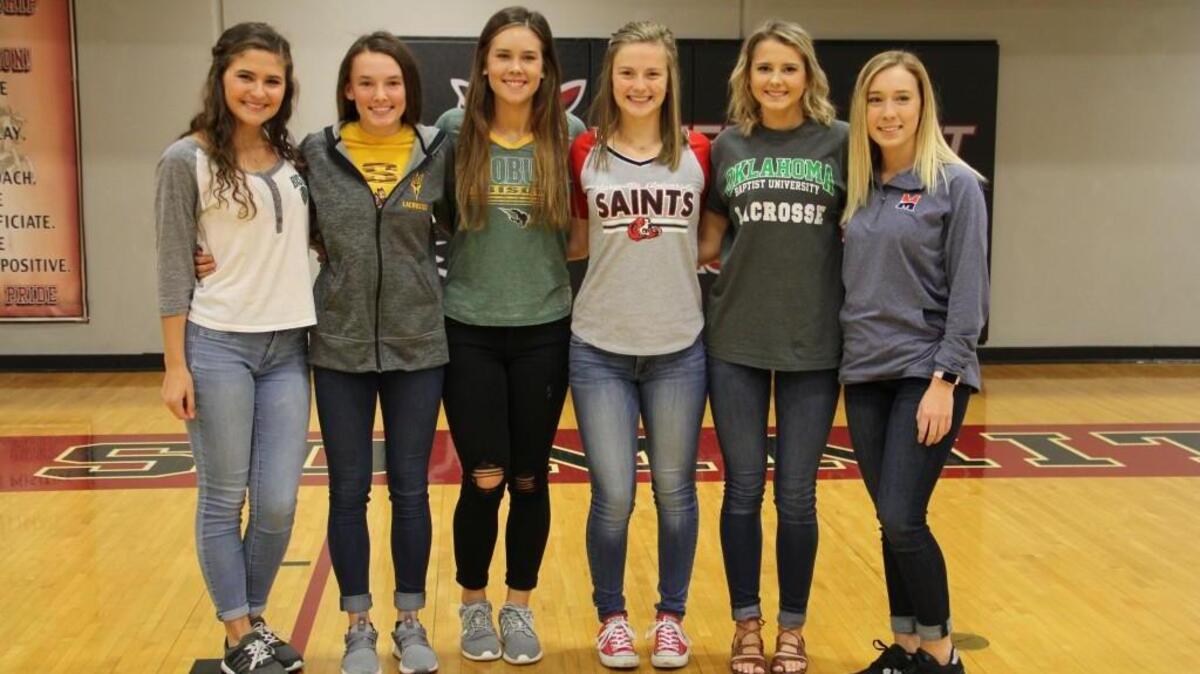 Six girls from Lee’s Summit North’s club lacrosse team signed national letters of intent Wednesday, Nov. 8, 2017, during a ceremony at the school. Pictured (from left): Shay Morgan, Oklahoma Baptist; Erica Odell, Arizona State; Madison Gordon, Oklahoma Baptist; Alexis Roe, Maryville University; Kiersten Steinbrugge, Oklahoma Baptist; and Paige Stahl, Midland University.