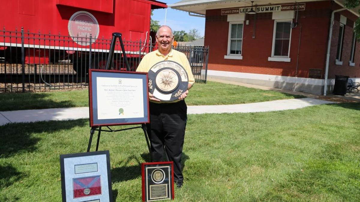 Lee’s Summit is an award-winning community known for its quality life, its Parks and Recreation Department, repeatedly getting named as one of the best communities in the U.S. to live. Mayor Randy Rhoads with a few of honors bestowed on his community, in a park with its iconic caboose and depot downtown.