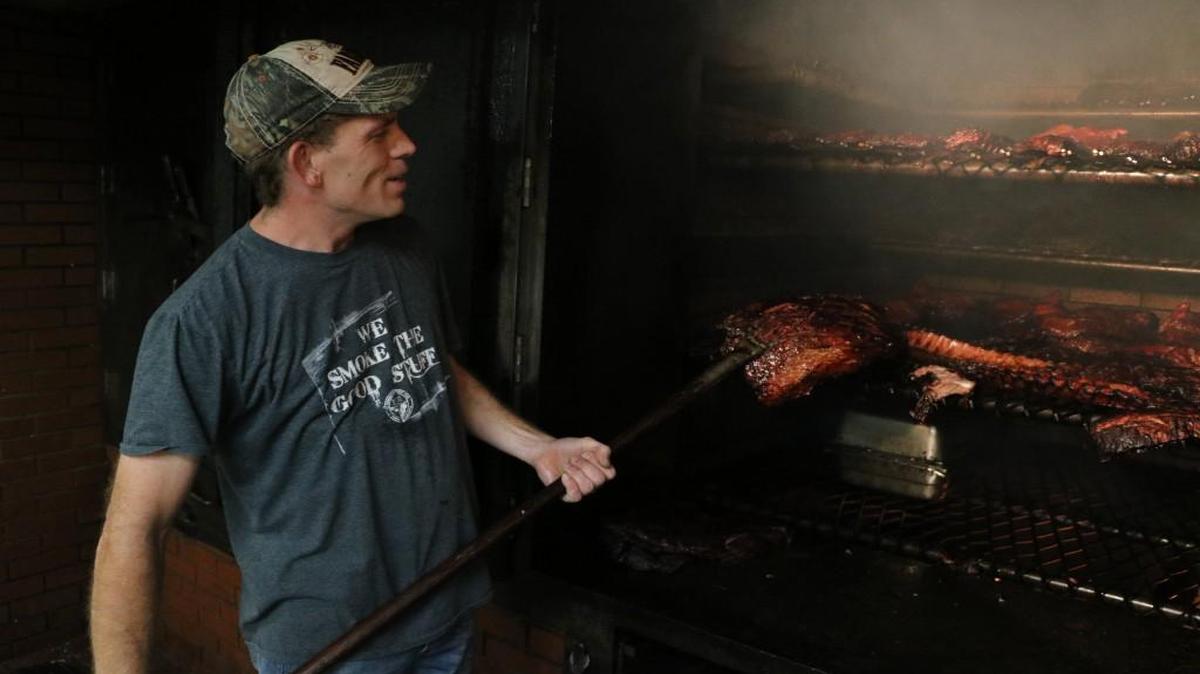 Allen Birchfield works the hickory-wood brick smoking pit at Summit Hickory Pit BBQ in Lee’s Summit. The son of Summit’s owners, Mike Ghani and Katy Birchfield, Allen started working at the restaurant at age 14 when it first opened. “Some people might not like it, but I enjoy working with my parents,” he says. “We are a family-oriented restaurant and family comes first. We don’t stay open late so we can be with our families.”