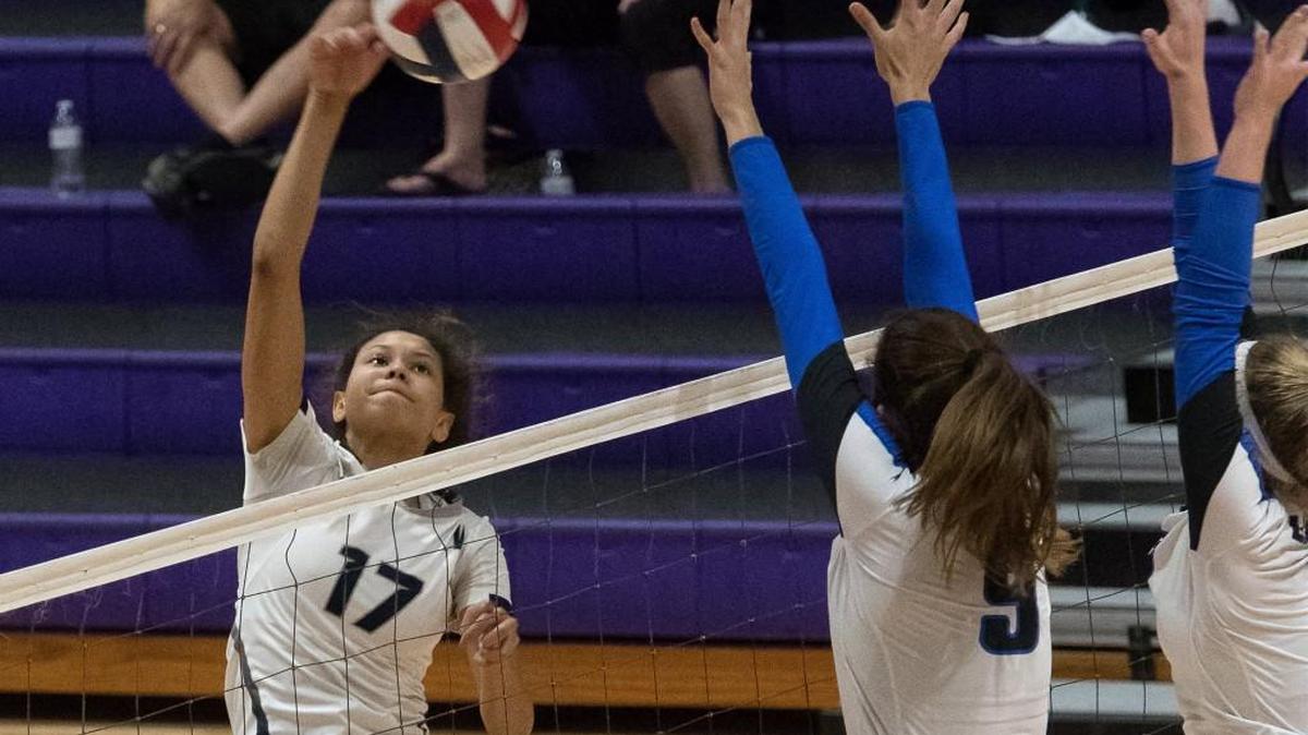 Lee’s Summit West’s Odyssey Warren takes a swing against Liberty during the Missouri Class 4 sectional volleyball tournament Saturday, October 21, 2017, at Park Hill South High School.