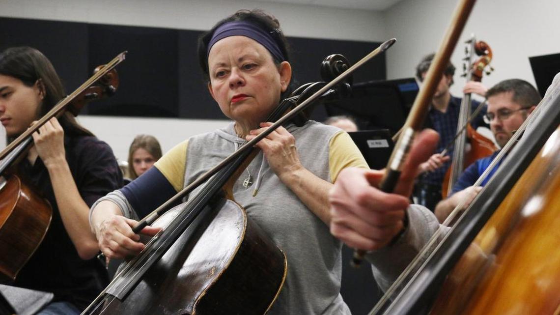 Lee’s Summit resident Sharry Willoughby plays the cello during a rehearsal of the Lee’s Summit Symphony.