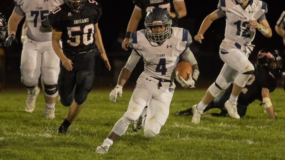 Lee’s Summit West running back Phillip Brooks (center) will try to find some running room against a Rockhurst defense that held Lee’s Summit North to 98 rushing yards last week.