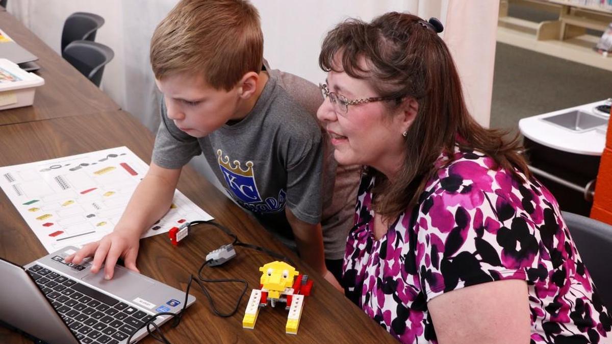 Jackson Standlea (left) built and programmed a roaring lion robot as his grandmother, Debi Mercer of Lee’s Summit, watched on Saturday, Dec. 2, 2017, at Lee’s Summit Library. Jackson is eager to learn about science and technology and hopes to becomes an engineer or architect, so the Mid-Continent Public Library’s STEAM-Powered Programs are a big hit for him.