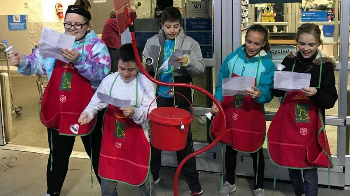 While ringing the Salvation Army bell at the Lee’s Summit Walmart, students from Richardson Elementary School sang Christmas carols. Pictured (from left) are Charlotte Hunsinger, Joey Beaver, Lincoln Hamaker, Kylie Binger and Norah Mason.