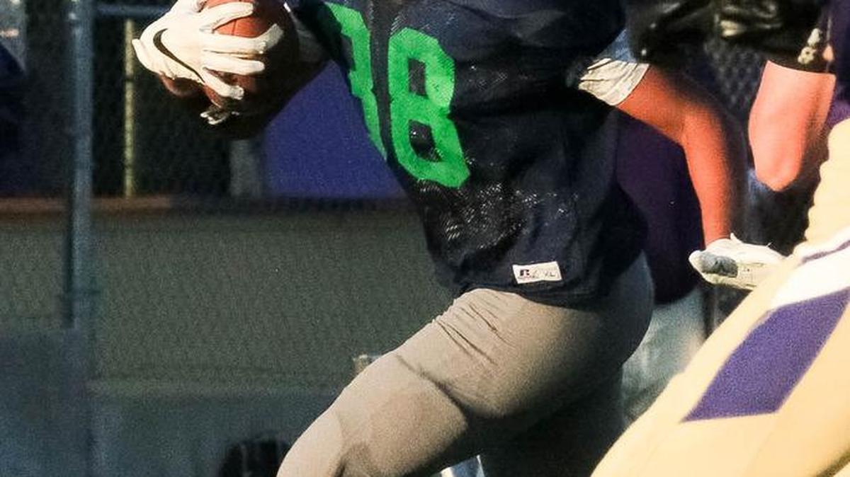 Brandon Lane looks for some running room for St. Michael the Archangel during a jamboree Friday at Pleasant Hill. Lane started at tight end last season for O’Hara, which closed last year.