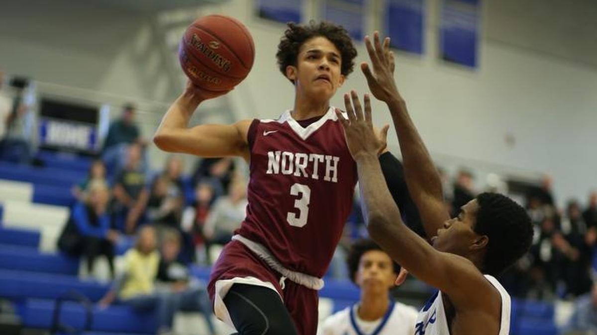 Javaunte Hawkins of Lee’s Summit North (left) leapt over Josh Clarendon of St. Joseph Central on his way to the basket during the opening game of the 810 Varsity Tipoff Classic on Saturday, Dec. 2, 2017, at Liberty. Hawkins scored a game-high 23 points in the Broncos’ 55-39 victory.