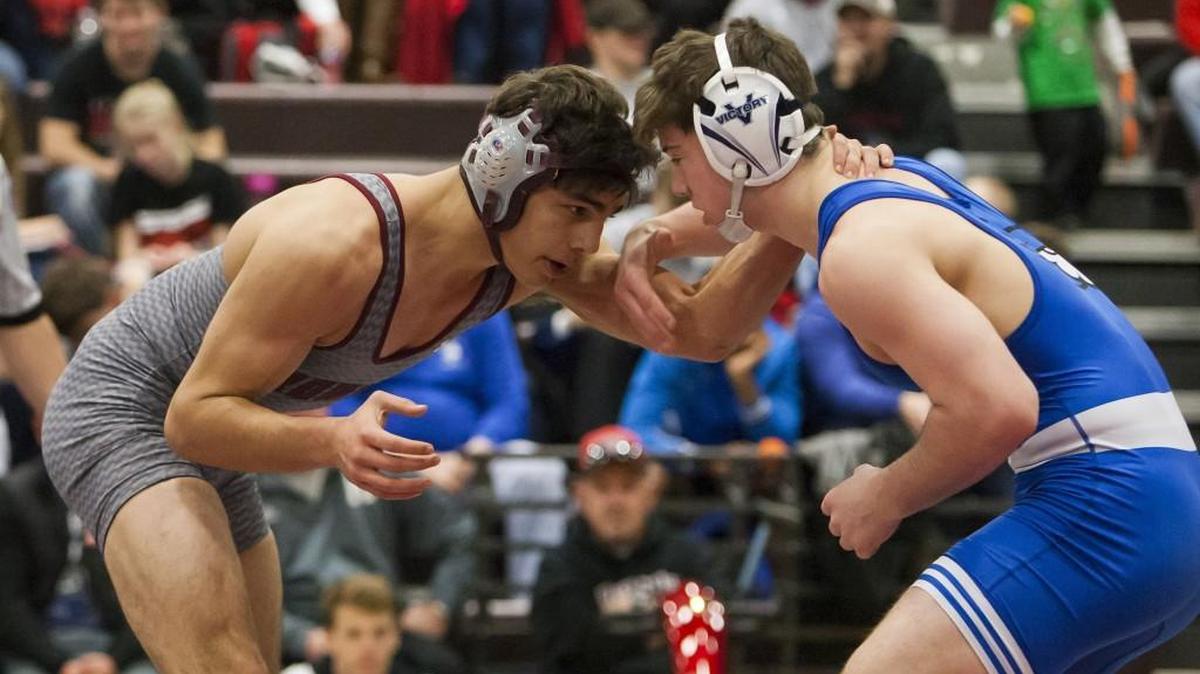 Adrian Castaneda (left), who squared off against Greyden Penner of Liberty in last month’s Lee's Summit North Wrestling Tournament, was one of three Broncos to win individual titles last weekend in Bonner Springs.