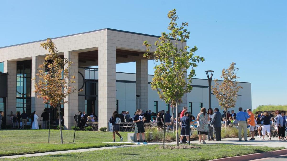 Hundreds of people arrived at St. Michael the Archangel Catholic High School on a sunny morning Friday, Aug. 4, 2017 for a blessing and dedication ceremony, marking the official opening of the new school in Lee’s Summit.