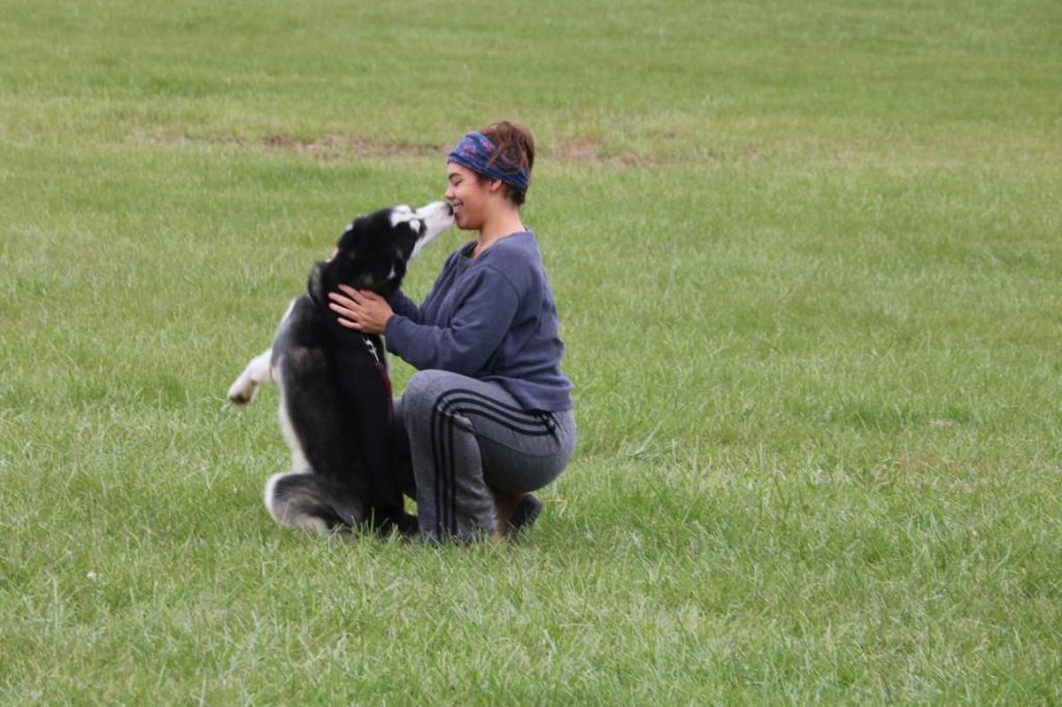 While out on a morning walk around the shelter property, Lee’s Summit Municipal Animal Shelter volunteer Jasmine Sowder cuddled with 2-year-old Siberian Husky, Kovu.
