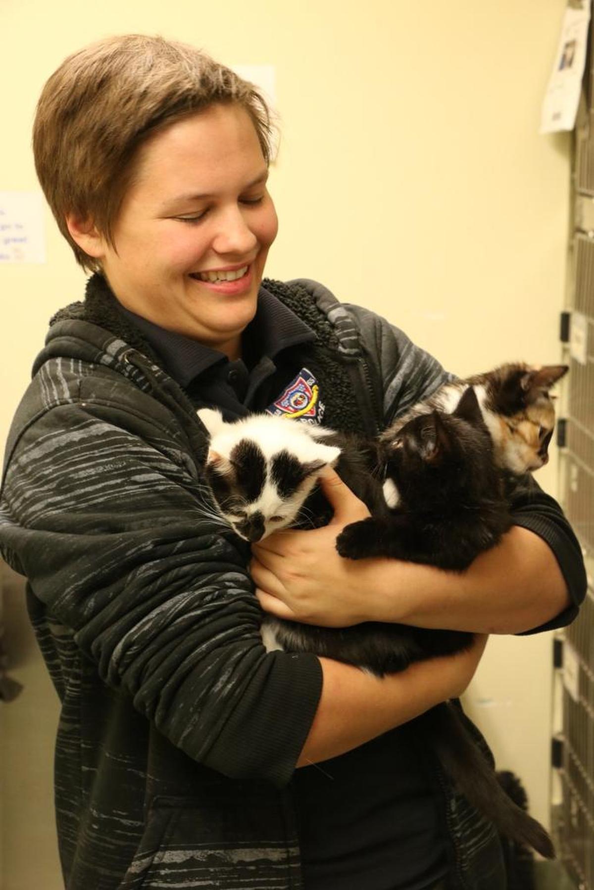 Missy Moeller, Lee’s Summit Municipal Animal Shelter attendant, takes three lively kittens, who recently arrived at the shelter, out for some play time. “I’m definitely all about the animals,” Moeller said. “This job is like a dream come true.”