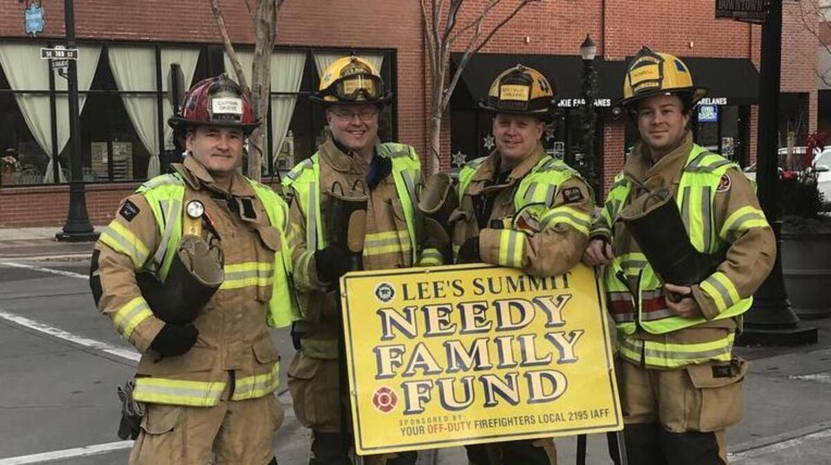 Captain Danny Grieve, left, Communications Specialist Grant Oetting, Fire Specialist Jimmy Childers and Firefighter Shawn Powell were among 50 fellow firefighters who volunteered their time this year for the annual IAFF Local 2195 Boot Block.