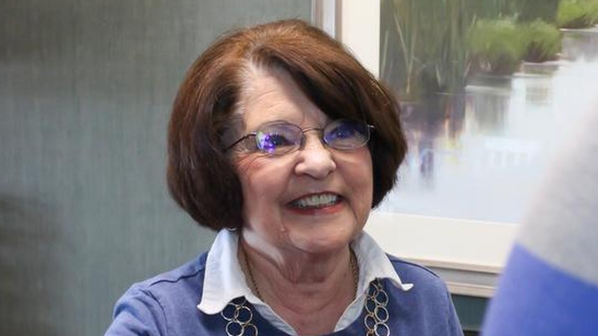 Colleen Harris, a volunteer with Village Hospice of John Knox Village, assists patients and families at the Village House in Lee’s Summit.