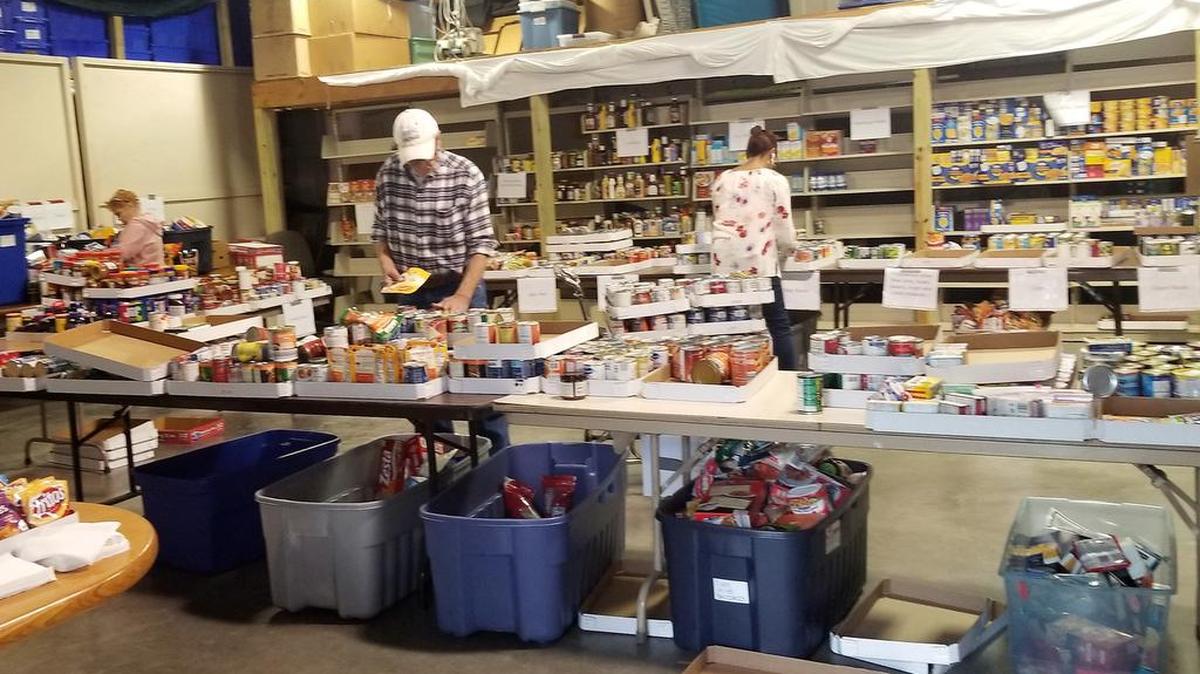 Lee’s Summit Social Services’ staff and volunteers spent hours and days sorting the food brought in by postal carriers as a part of the 27th annual Stamp Out Food Drive.