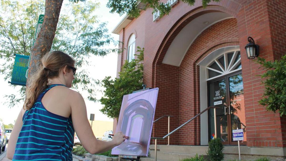 About 20 artists participated in GOT Art Gallery’s “Plein Air Paint Out” contest on Friday, Aug. 25, 2017 in downtown Lee’s Summit during Fourth Fridays Art Walk. Vanessa Lacy, an artist from Kansas City, was one of the artists who camped out and painted for a couple hours outside an Edward Jones building at S.E. Douglas Street for the contest.