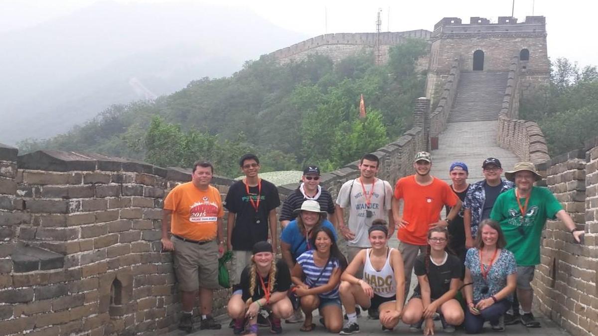 Team Titanium at the Great Wall in China. (Back from the left) Jeff Spatz, Antonio Cea, Aaron Bailey, James Roy, Daniel Schnelle, Alex Wood, Eli Cook, Micheal Hartwig (front) Samantha Fuehrer, Erica Bailey, Phanna Cea, Emma Costello, Justice Weber, Nancy Spatz.