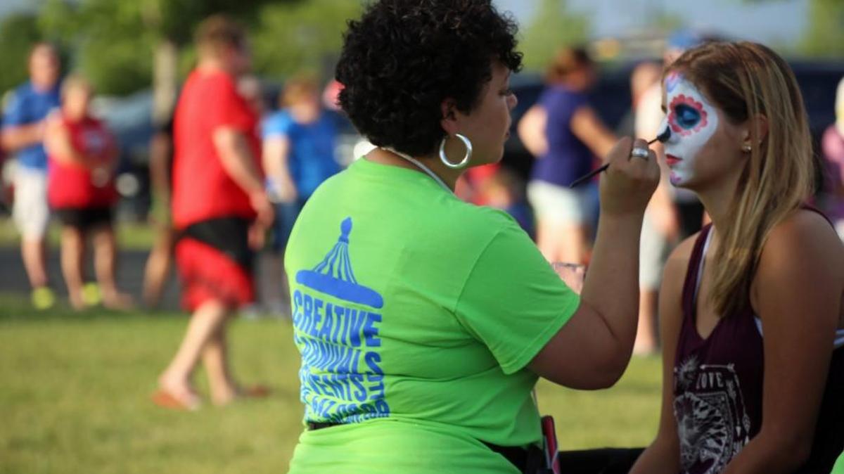 Dona Marie Ferro, 14, of Lee's Summit who attends school at Blue Springs Freshman Center, was among many children and teens who got their faces painted waiting on the sky to go dark so fireworks could start at Legacy Blast this year.