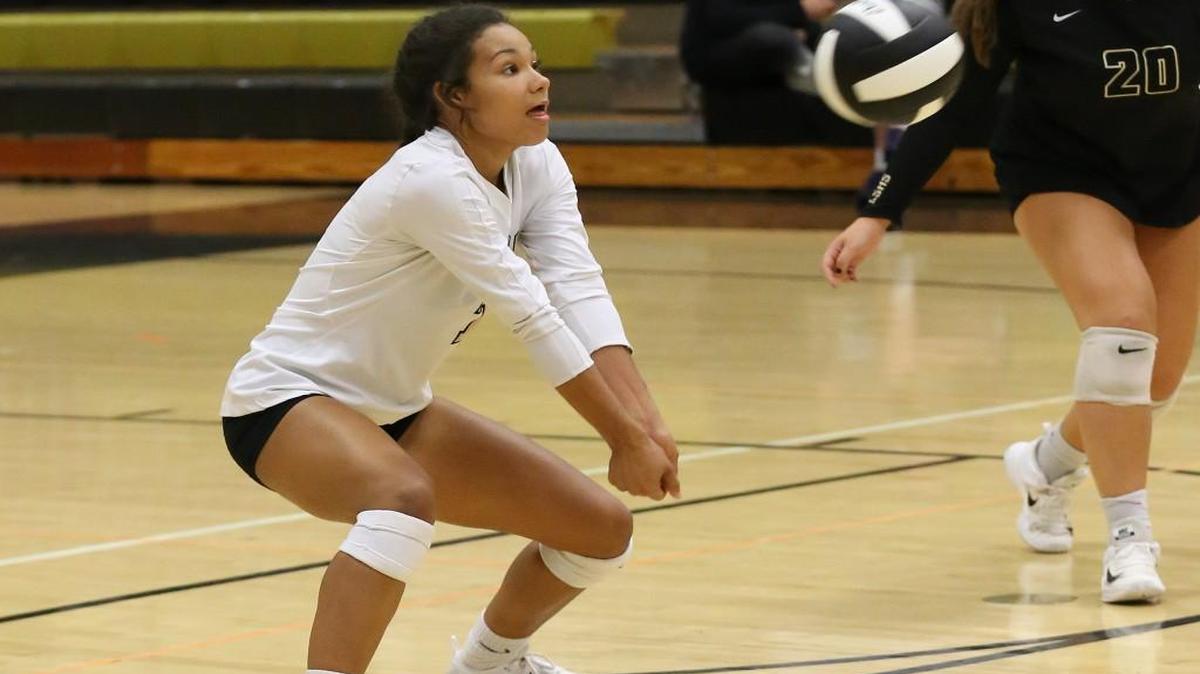 Lee’s Summit libero Kennedy Buckner passes the ball during the Tigers’ match against St. Teresa’s Academy on Tuesday at Lee’s Summit. Serving troubles led to a 25-21, 25-16 loss for the Tigers.