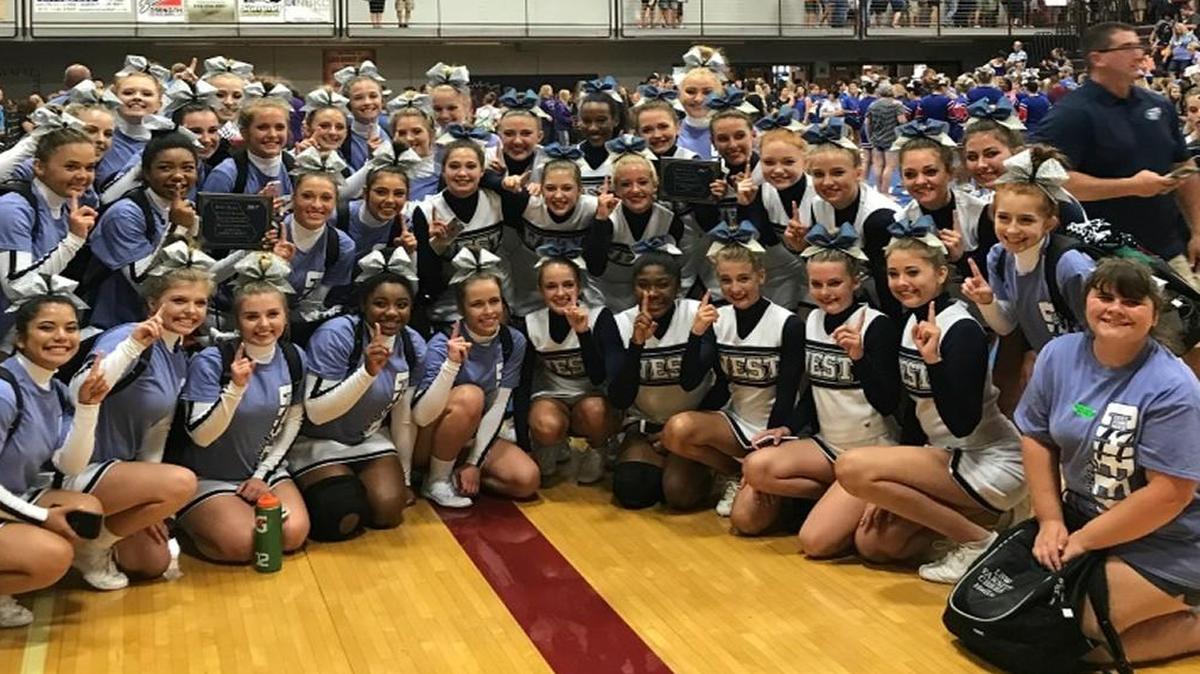 The junior varsity cheerleading team at Lee’s Summit West High School.