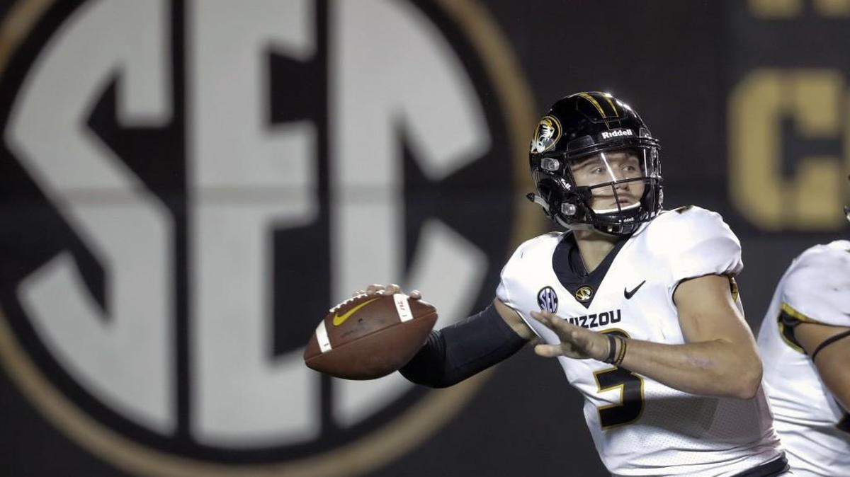 Despite leading the nation in touchdown passes last fall, Missouri and AP All-SEC quarterback Drew Lock — shown here throwing a pass against Vanderbilt on Nov. 18 in Nashville, Tenn. — will return for his senior season after deciding not to leave early for the NFL Draft.
