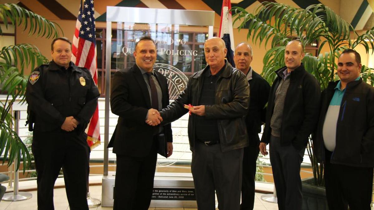 Lee’s Summit Police Chief Travis Forbes and Mayor Bill Baird received $3,000 in gift cards from Don Cosentino, James Cosentino, Dante Cosentino and Jimmy Cosentino Jr. for police to hand out to families in need.