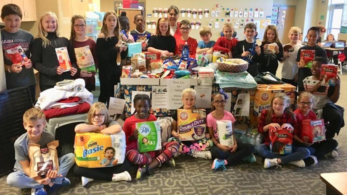 Inspired by a story they read in class, the students in Brenda Hall’s Summit Pointe Elementary School fourth-grade class collected designed and distributed fliers seeking donations for Wayside Waifs animal shelter.