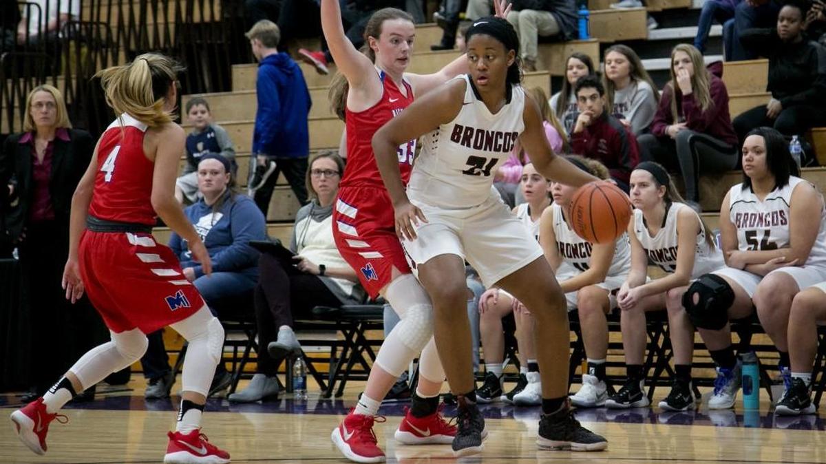 Lee’s Summit North’s Aiyana Johnson (right) worked against Bishop Miege’s Ashton Verhulst on Friday, Dec. 15, 2017, during the Cable Dahmer Shootout at Avila University in Kansas City, Mo. Johnson and the Broncos ended a two-game losing streak Tuesday with a 46-35 victory at Raymore-Peculiar.