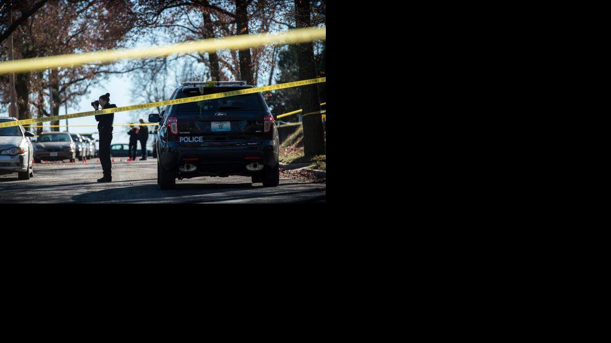 
Kansas City Police Department crime scene investigators photographed evidence at the scene of a shooting Tuesday at 37th Street and Monroe Avenue.
