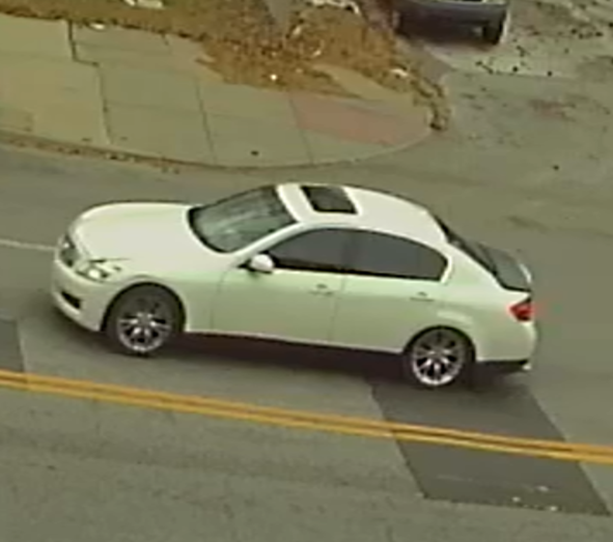 Kansas City, Kan., police Wednesday night found this white Infiniti unoccupied near Quindaro Boulevard and Fairfax Trafficway. The car was seen Wednesday near the scene where Frank Davila was killed when he was dragged in the street while trying to prevent the theft of his truck.