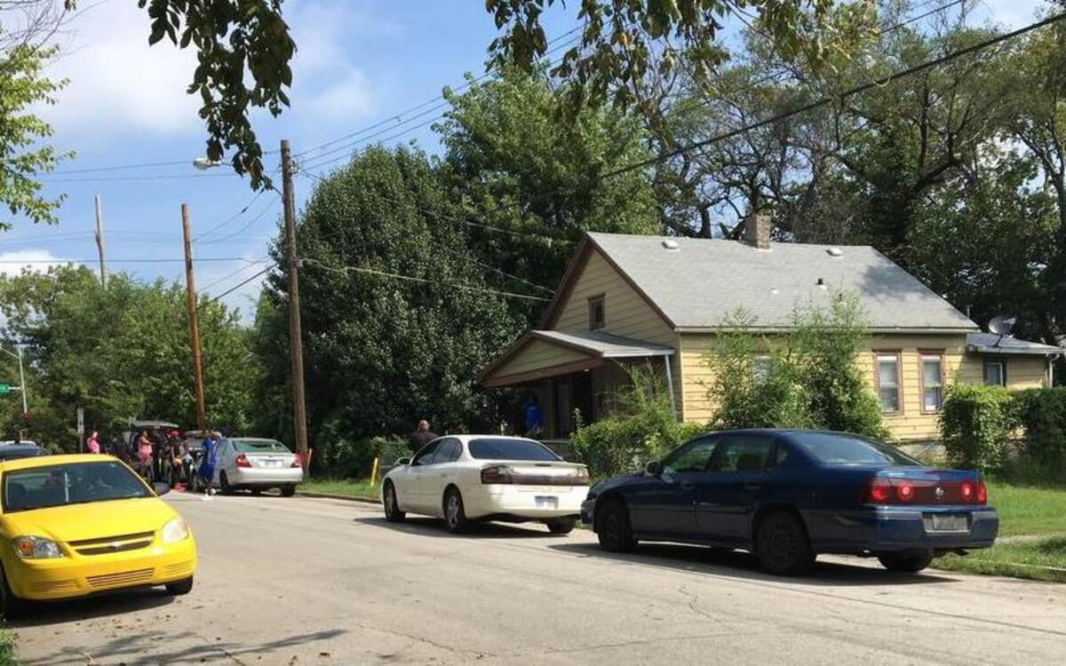Family members gathered outside a house in the 2400 block of North Ninth Street in Kansas City, Kan., where a mother of three teenagers was killed in a drive-by shooting early Tuesday. Family members urged anyone with information or who has surveillance video from the area to call police to help with the investigation.