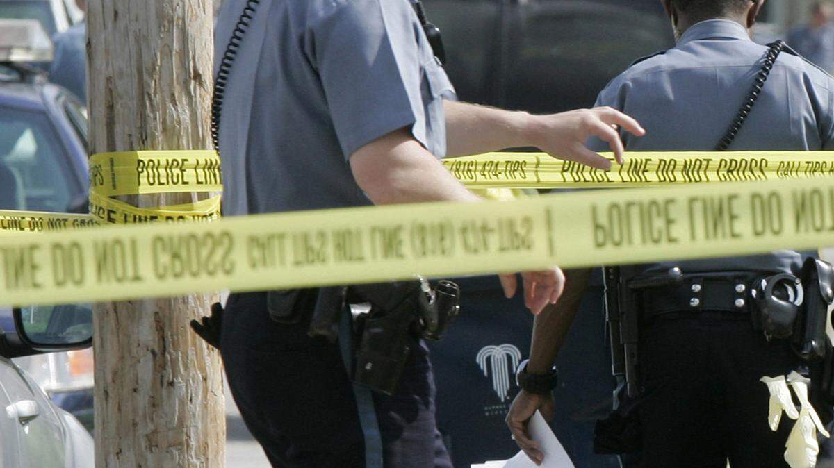 2010 file photo: A bystander watched from the outside of the crime scene tape along 26th Street on Tuesday afternoon in the aftermath of a double shooting. Two people were critically injured in a shooting that occurred at 26th Street and Bellefontaine Avenue on late Tuesday afternoon, April 27, 2010. Police were summoned to the area at around 3:45 p.m.
