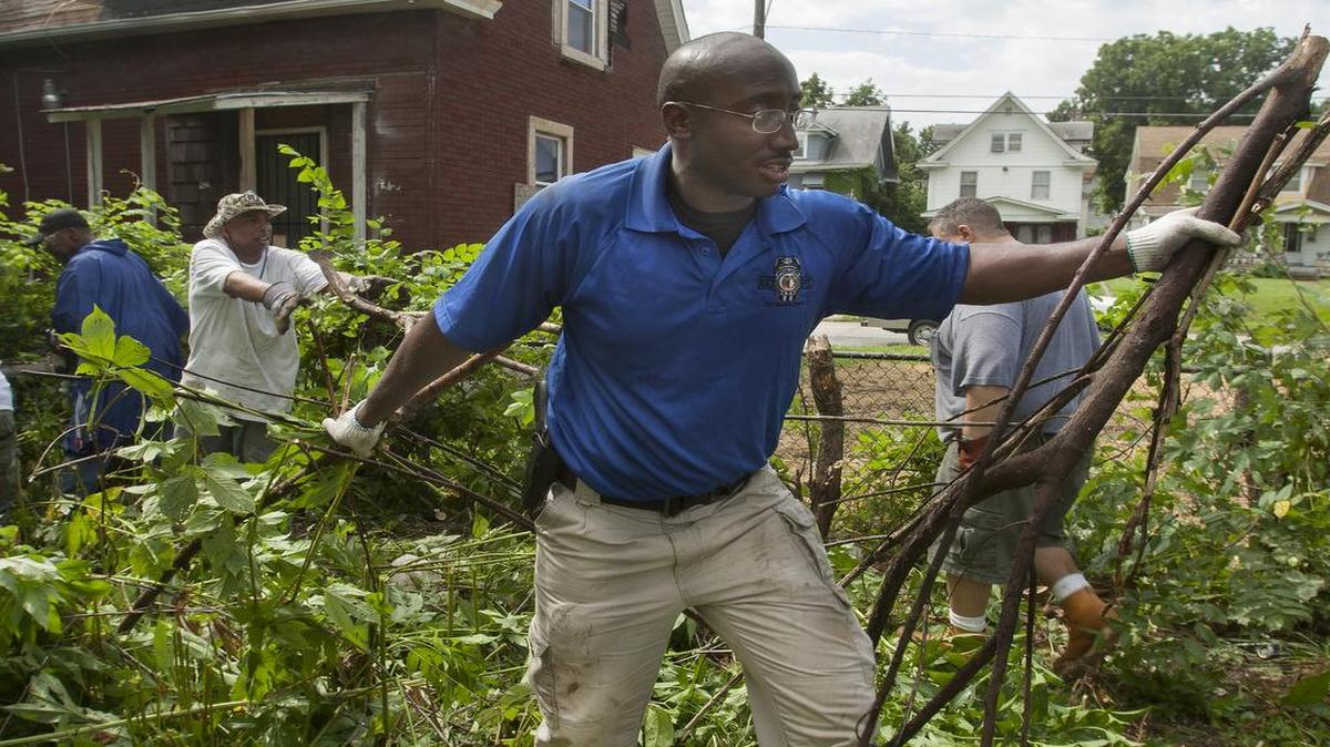 
Michael Lenoir with the Kansas City Police Department helped clear a vacant lot at 27th Street and Montgall Avenue on Saturday during a Kansas City No Violence Alliance cleanup of the Prospect Avenue Corridor.
